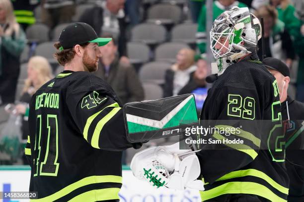 Jake Oettinger of the Dallas Stars is congratulated by Scott Wedgewood following the game against the Arizona Coyotes at American Airlines Center on...