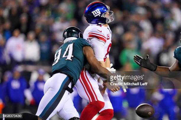 Josh Sweat of the Philadelphia Eagles forces a fumble against Daniel Jones of the New York Giants during the fourth quarter in the NFC Divisional...
