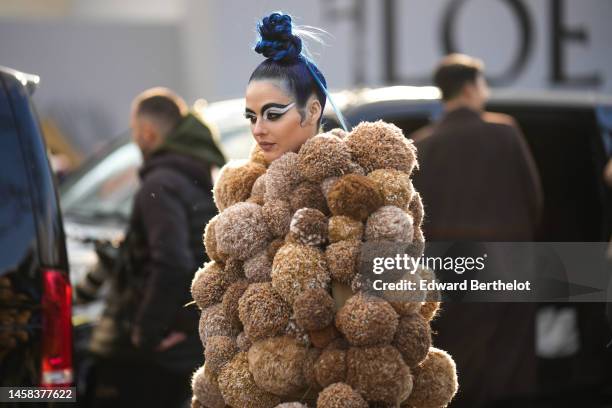 Sita Abellan wears a brown and beige oversized embroidered pompom bomber fluffy coat from Loewe, outside Loewe, during Paris Fashion Week - Menswear...