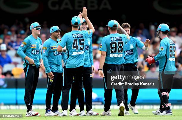 Matthew Renshaw of the Heat celebrates with his team mates after taking the catch to dismiss Campbell Kellaway of the Stars during the Men's Big Bash...