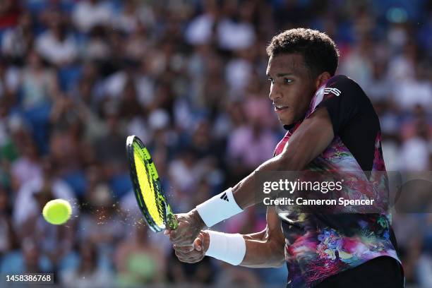 Felix Auger-Aliassime of Canada plays a backhand during the fourth round singles match against Jiri Lehecka of the Czech Republic during day seven of...