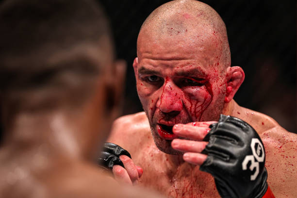 Glover Teixeira of Brazil battles Jamahal Hill in the UFC light heavyweight championship fight during the UFC 283 event at Jeunesse Arena on January...