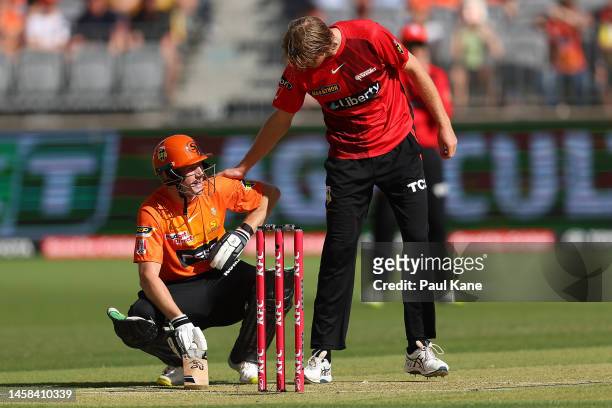 David Moody of the Renegades checks on Cameron Bancroft of the Scorchers after bowling a beamer during the Men's Big Bash League match between the...
