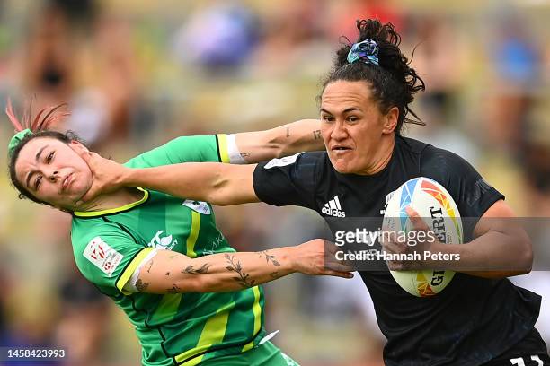 Portia Woodman-Wickliffe of New Zealand fends off the tackle from Natasja Behan of Ireland during the 2023 HSBC Sevens match between New Zealand and...
