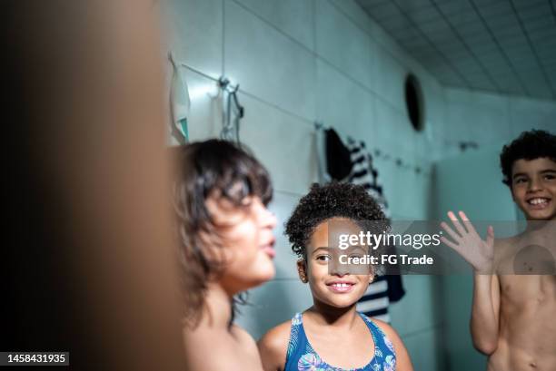 kids talking in the swimming club locker room - young boys changing in locker room stock pictures, royalty-free photos & images