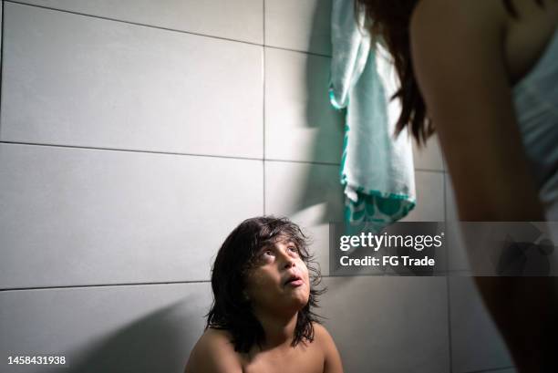 boy talking to his mother in the swimming club locker room - young boys changing in locker room 個照片及圖片檔