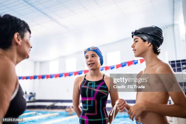 teacher and kids talking in the poolside - preteen girl no shirt stock pictures, royalty-free photos & images