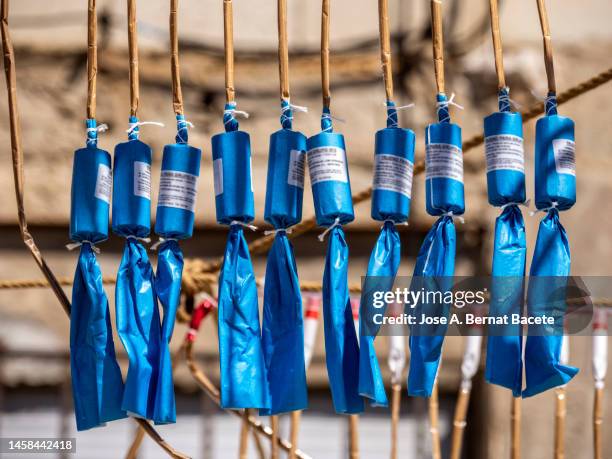 large rockets prepared for a daytime fireworks display, pyrotechnic show called "mascleta". - petard stock pictures, royalty-free photos & images