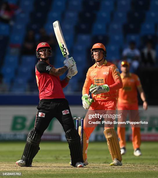 Alex Hales of Desert Vipers hits a six watched by Tom Banton during the DP World ILT20 match between Desert Vipers and Gulf Giants at Dubai...