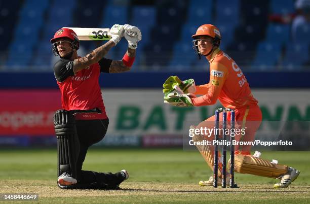 Alex Hales of Desert Vipers hits a six watched by Tom Banton during the DP World ILT20 match between Desert Vipers and Gulf Giants at Dubai...