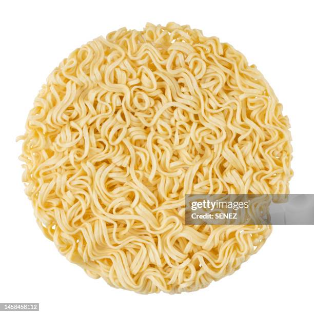 dry uncooked instant noodles on white background - ramen noodles fotografías e imágenes de stock