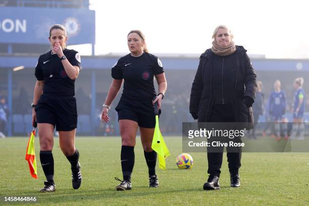 Assistant referee Georgia Ball and Chloe-Ann Small walk off the pitch with Emma Hayes, Manager of Chelsea after the match is postponed in the FA...