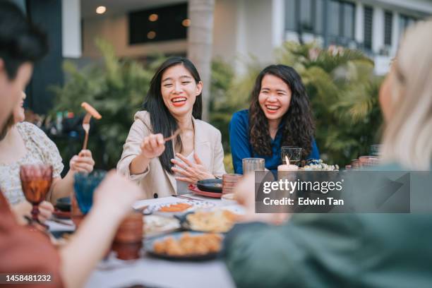asian chinese lesbian couple and friends enjoying outdoor dining together - asian restaurant bildbanksfoton och bilder