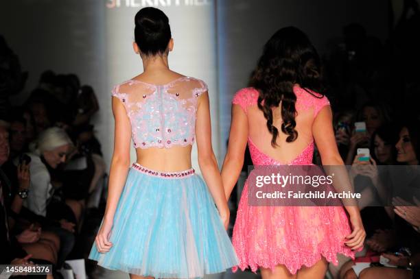 Kendall Jenner and Kylie Jenner on the runway at Evening Sherri Hill's spring 2013 show at Trump Tower.