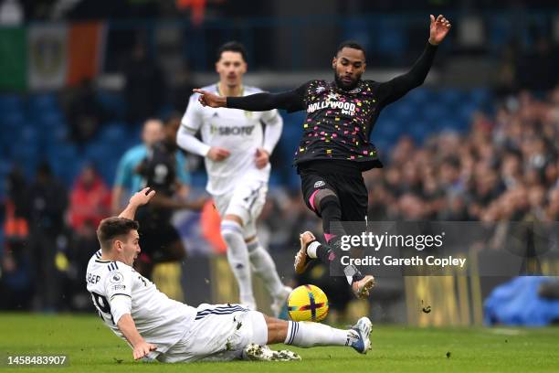 Rico Henry of Brentford is challenged by Maximilian Woeber of Leeds United during the Premier League match between Leeds United and Brentford FC at...