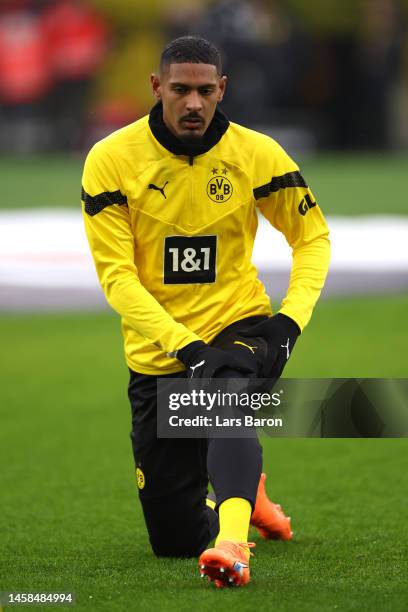 Sebastien Haller of Borussia Dortmund warms up whilst wearing Puma boots with the inscription 'F*ck Cancer' prior to the Bundesliga match between...