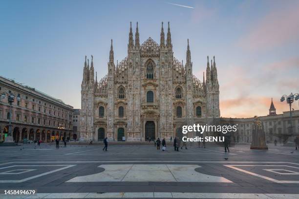 milan cathedral and cathedral square at dawn - milan landmark stock pictures, royalty-free photos & images