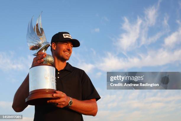 Victor Perez of France poses for a photo with the trophy after winning the final round of the Abu Dhabi HSBC Championship at Yas Links Golf Course on...