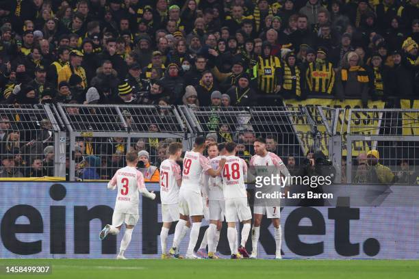 Arne Maier of FC Augsburg celebrates after scoring the team's first goal with teammates during the Bundesliga match between Borussia Dortmund and FC...