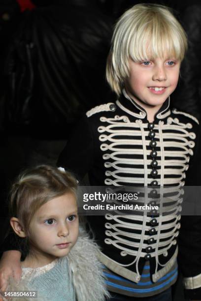 The children of model Natalia Vodianova, Neva Portman and Alexander Portman backstage at Alexander Wang's fall 2010 runway show.