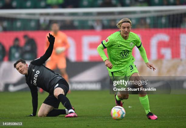 Sebastiaan Bornauw of Wolfsburg is challenged by Michael Gregoritsch of Freiburg during the Bundesliga match between VfL Wolfsburg and Sport-Club...