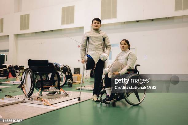 portrait of a male and female fencers preparing for a walking exercise. - mask confrontation stock pictures, royalty-free photos & images