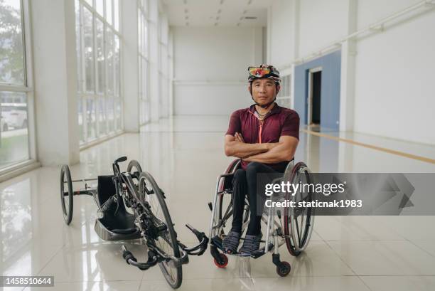 confident paraplegic cyclist looking at camera. - wheelchair race stock pictures, royalty-free photos & images
