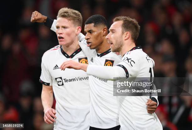 Marcus Rashford celebrates with Scott McTominay and Christian Eriksen of Manchester United after scoring the team's first goal during the Premier...