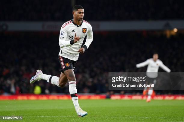 Marcus Rashford of Manchester United celebrates after scoring the team's first goal during the Premier League match between Arsenal FC and Manchester...