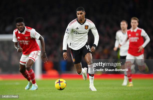 Marcus Rashford of Manchester United runs with the ball before scoring their sides first goal during the Premier League match between Arsenal FC and...