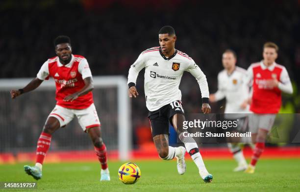 Marcus Rashford of Manchester United runs with the ball before scoring their sides first goal during the Premier League match between Arsenal FC and...