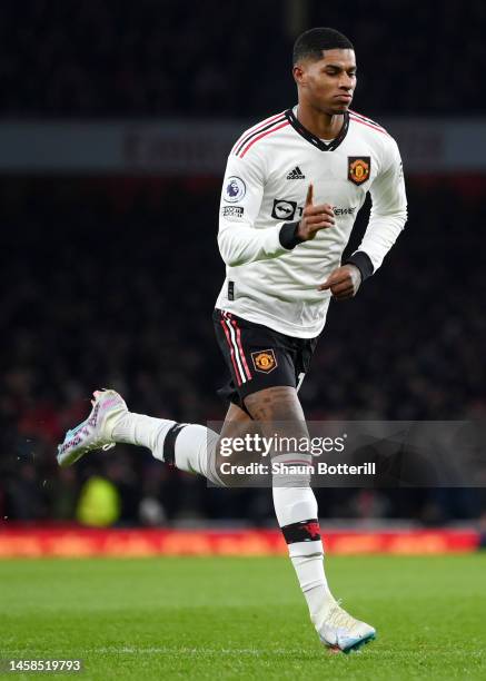 Marcus Rashford of Manchester United celebrates after scoring the team's first goal during the Premier League match between Arsenal FC and Manchester...