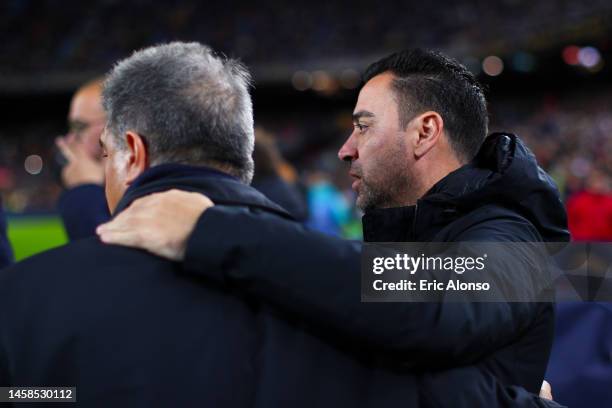 Xavi Hernandez, head coach of FC Barcelona hugs Joan Laporta, president of FC Barcelona during the LaLiga Santander match between FC Barcelona and...