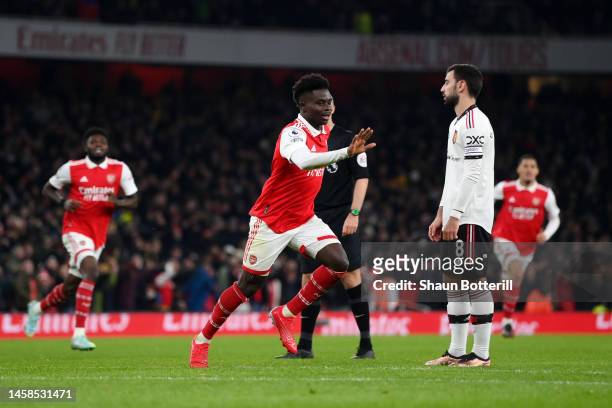Bukayo Saka of Arsenal celebrates after scoring the team's second goal during the Premier League match between Arsenal FC and Manchester United at...