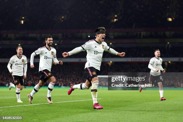 Lisandro Martinez celebrates with Bruno Fernandes and Christian Eriksen of Manchester United after scoring the team's second goal during the Premier...