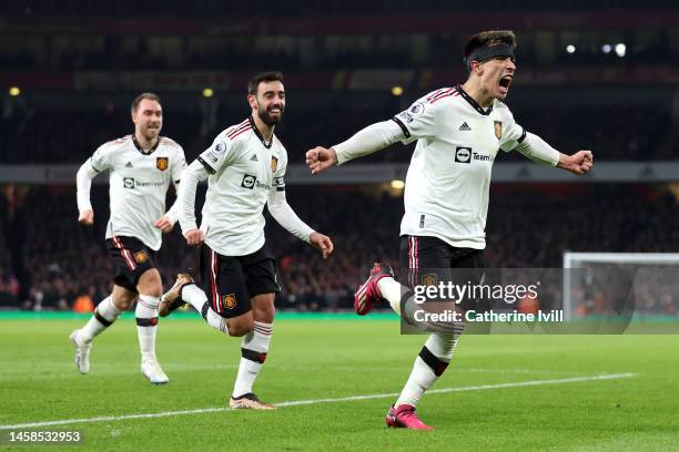 Lisandro Martinez celebrates with Bruno Fernandes and Christian Eriksen of Manchester United after scoring the team's second goal during the Premier...