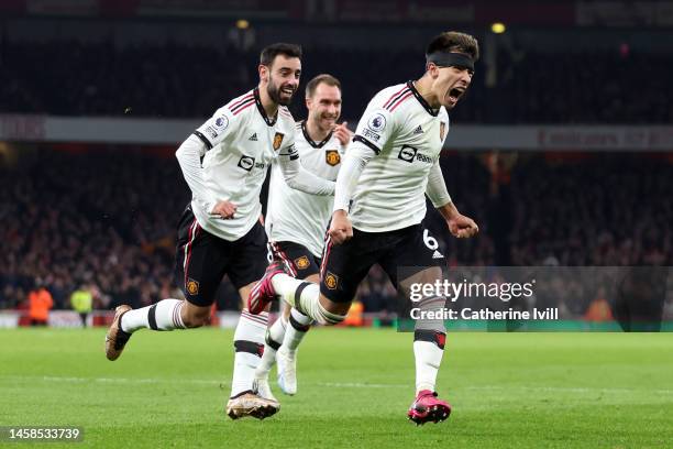 Lisandro Martinez celebrates with Bruno Fernandes and Christian Eriksen of Manchester United after scoring the team's second goal during the Premier...