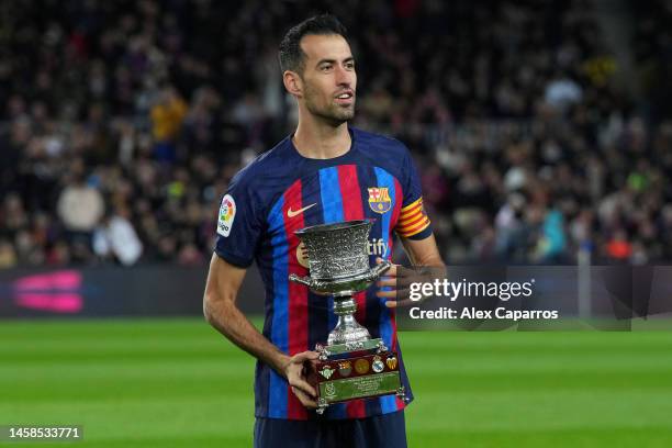 Sergio Busquets of FC Barcelona presents the Spanish Supercopa Trophy to the fans prior to the LaLiga Santander match between FC Barcelona and Getafe...