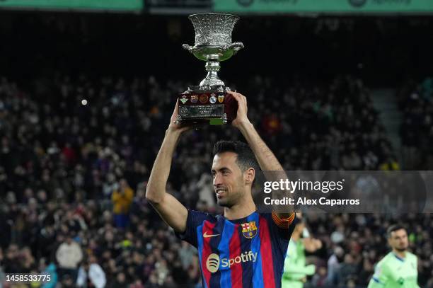 Sergio Busquets of FC Barcelona presents the Spanish Supercopa Trophy to the fans prior to the LaLiga Santander match between FC Barcelona and Getafe...