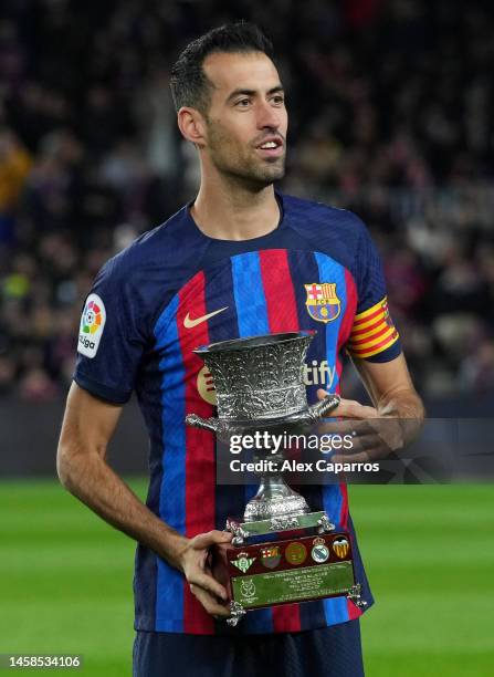 Sergio Busquets of FC Barcelona presents the Spanish Supercopa Trophy to the fans prior to the LaLiga Santander match between FC Barcelona and Getafe...