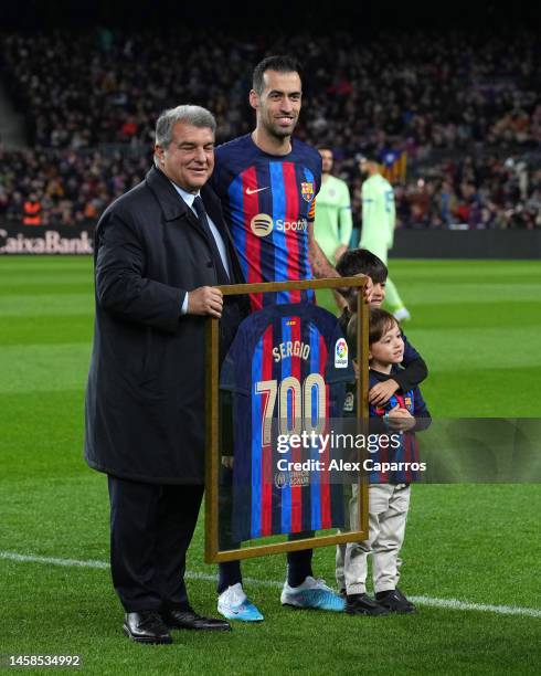 Sergio Busquets of FC Barcelona is presented with a shirt by FC Barcelona President Joan Laporta, to commemorate their 700 Appearances for FC...