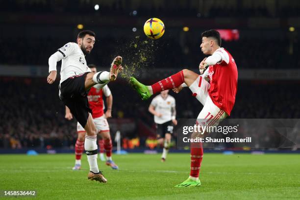 Bruno Fernandes of Manchester United battles for possession with Gabriel Martinelli of Arsenal during the Premier League match between Arsenal FC and...