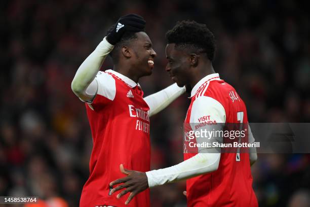 Eddie Nketiah celebrates with Bukayo Saka of Arsenal after scoring the team's third goal during the Premier League match between Arsenal FC and...