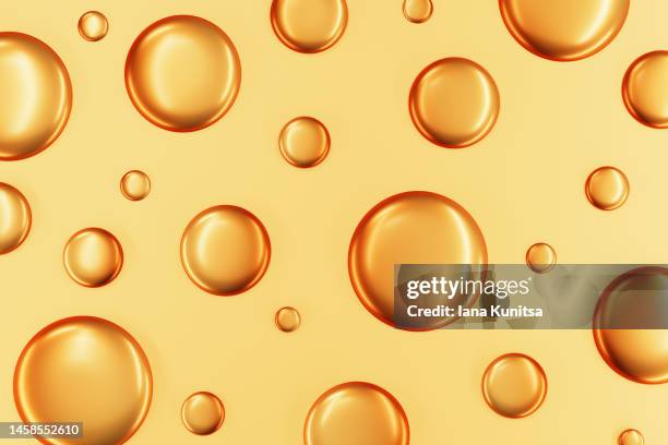 gold liquid drops. 3d bubbles pattern. cosmetic products for makeup and skin care. - gold circle 3d stock pictures, royalty-free photos & images