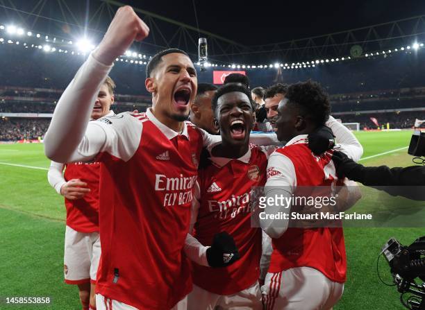 Bukayo Saka celebrates scoring the 2nd Arsenal goal with Willam Saliba and Eddie Nketiah during the Premier League match between Arsenal FC and...