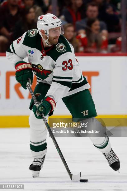 Alex Goligoski of the Minnesota Wild skates with the puck against the Florida Panthers at the FLA Live Arena on January 21, 2023 in Sunrise, Florida.