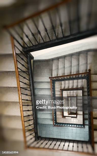 steep geometric staircase inside old residential building - wooden staircase stock pictures, royalty-free photos & images