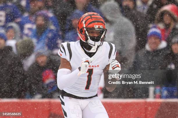 Ja'Marr Chase of the Cincinnati Bengals celebrates after scoring a touchdown against the Buffalo Bills during the first quarter in the AFC Divisional...