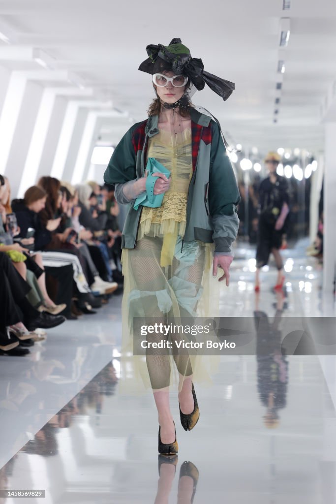 A model walks the runway during the Maison Margiela Menswear... News ...