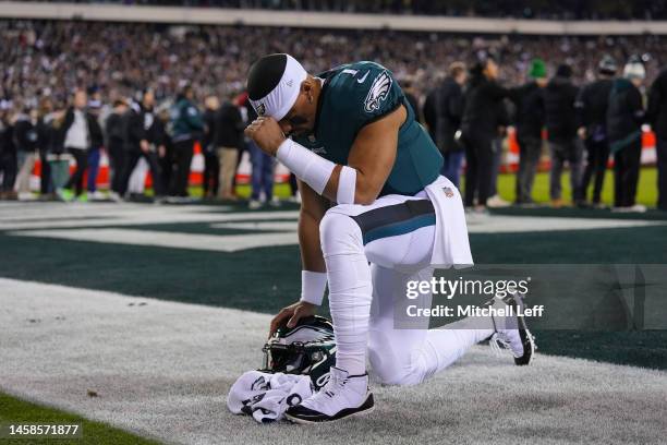 Jalen Hurts of the Philadelphia Eagles prays against the New York Giants during the NFC Divisional Playoff game at Lincoln Financial Field on January...